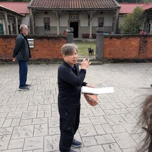Standing in the plaza with the pond in the front