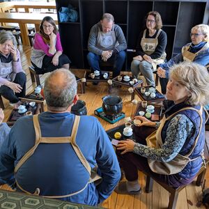 We learn to brew.  Note the hot water cauldron in the center