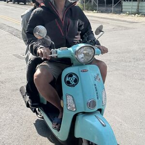 We were delivered from the beach hanging on the back of scooters