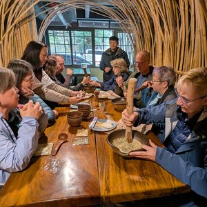 Deborah working hard to grind the seeds